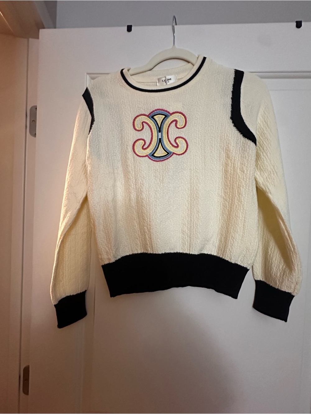 Cream and Black Crewneck Sweater with Embroidered Crest